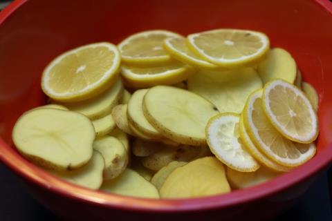 Sliced potatoes and lemons